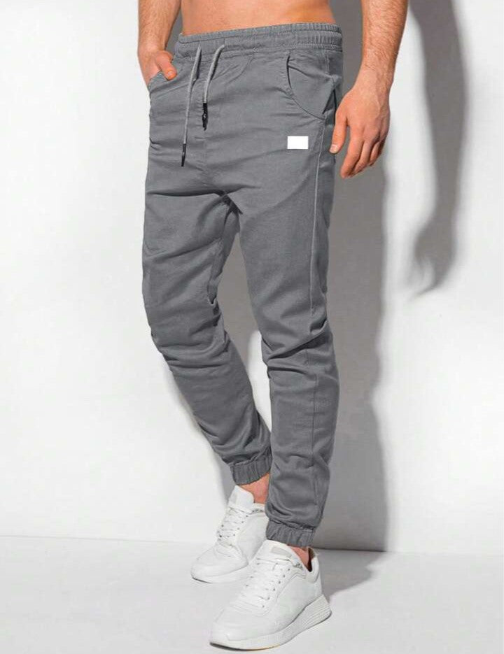 Manfinity Homme Pantalones jogger para hombre con bolsillos parche y puños elásticos, otoño