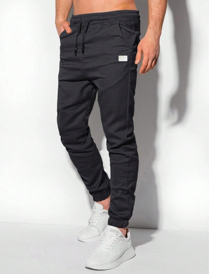 Manfinity Homme Pantalones jogger para hombre con bolsillos parche y puños elásticos, otoño