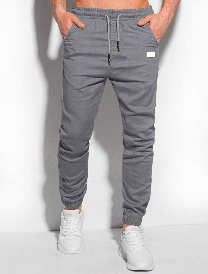 Manfinity Homme Pantalones jogger para hombre con bolsillos parche y puños elásticos, otoño